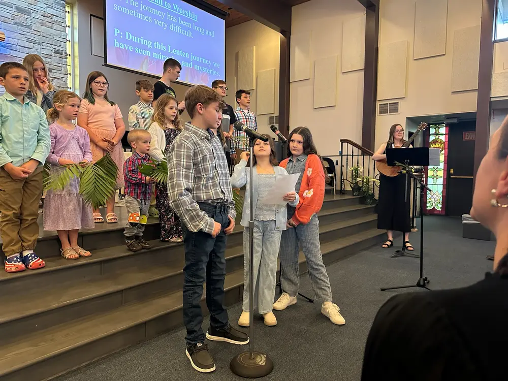 Children's choir singing during family service